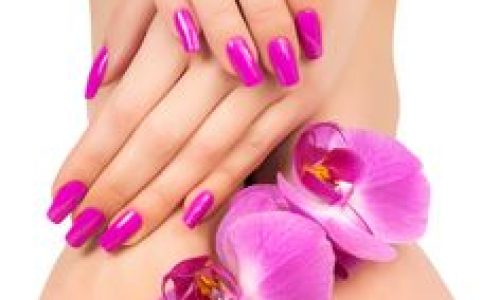 Relaxing pink manicure and pedicure with a orchid flower